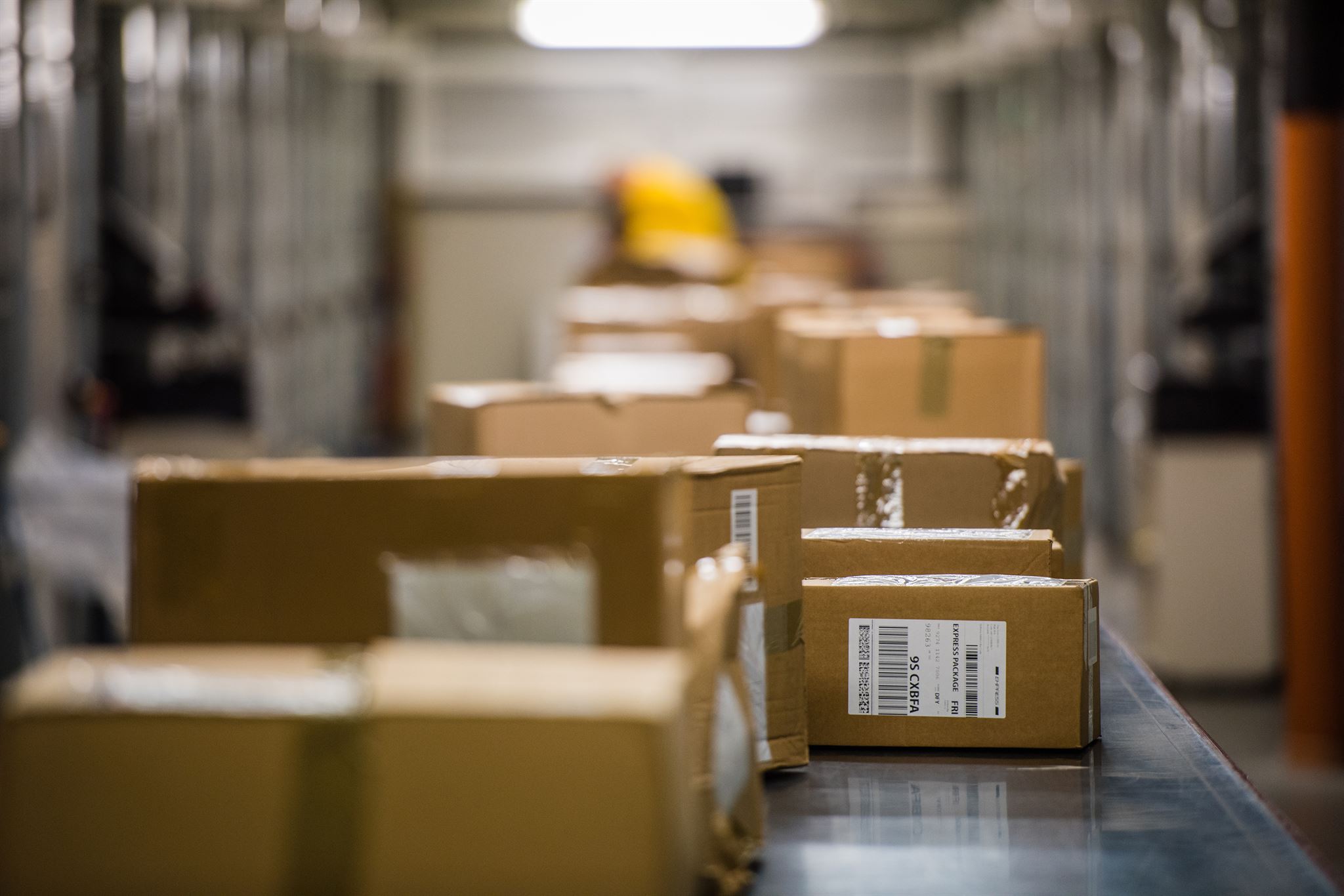 Image of movers packing boxes